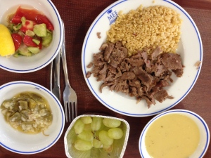 Red lentil soup. Doner kebab and tabouleh. Cold green bean and rice salad. Cucumber and tomato salad. Grapes.